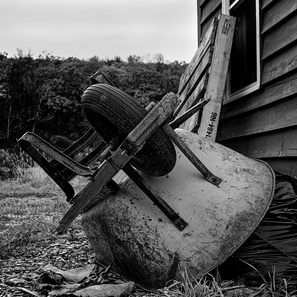 Photo of an overturned wheelbarrow.