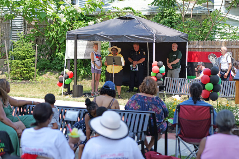 Photo of a group reading Frederick Douglass' Fourth of July address in Fitchburg.