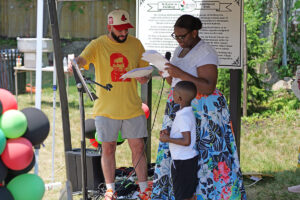 Photo of youth reading Frederick Douglass' Fourth of July address in Fitchburg.