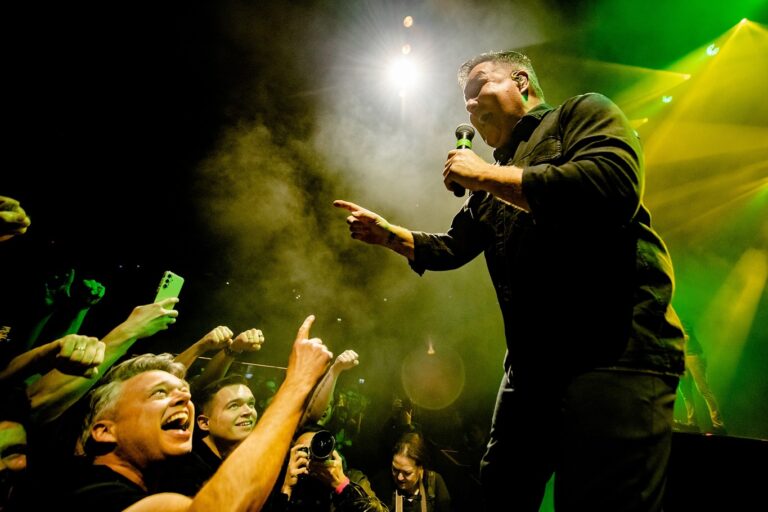 Ken Casey of the Dropkick Murphys performs on stage.