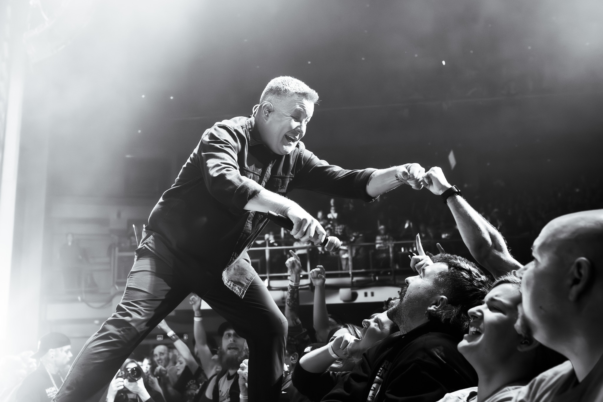 Ken Casey performs on stage.