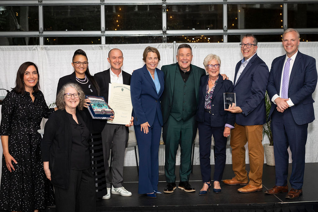 First Lady Joanna Lydgate, State Representative Patricia Duffy, Mass Humanities Board Member Brittney Walley, Executive Director Brian Boyles, Governor Maura Healey, Ken Casey, Eileen Kelly, Mass Humanities Board Chair Aaron Vega, State Representative Sean Garballey.